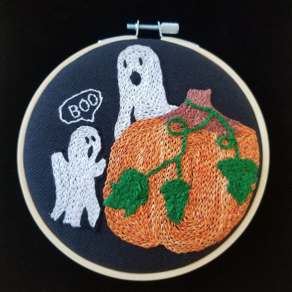 Pumpkin! Hand Embroidered with Orange floss, onto a Black canvas Fabric. 3.5in.